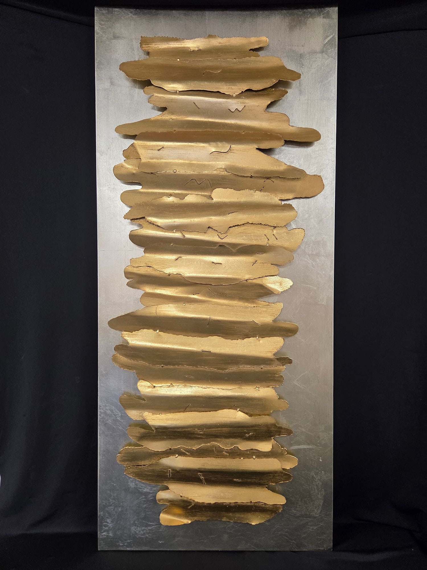 UTTERMOST GOLD & SILVER TONE METAL WALL DECOR: Uttermost Metal Wall Decor featuring gold tone strips set on a distressed silver- tone iron backing. May be hung horizontal or vertical. Measures 23 H x 27.5 W x 1.25 D. Some wear on sides due to age 
