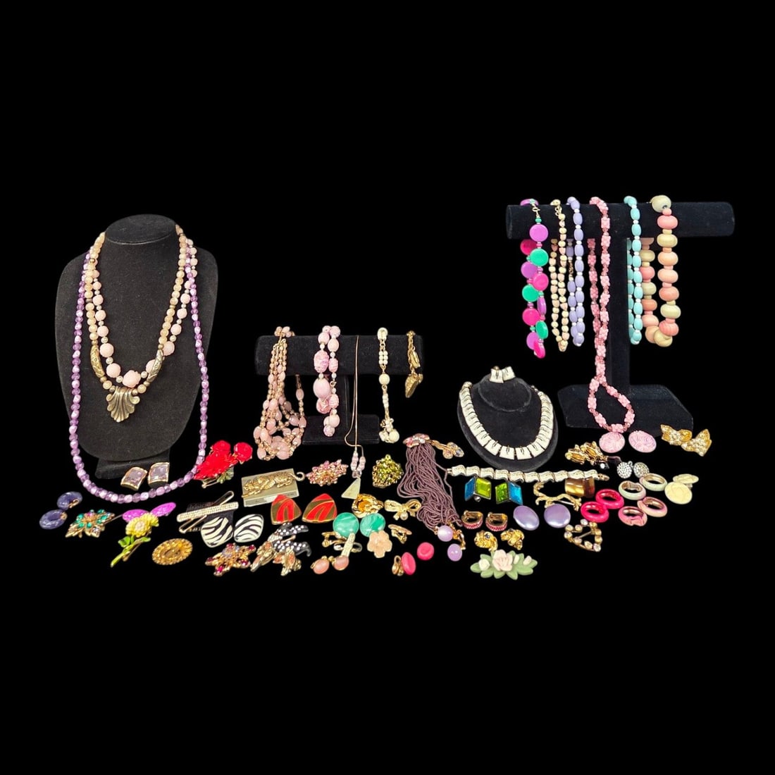 LARGE LOT OF PASTEL COLORED BEADS, BROOCHES, & EARRINGS: This lot consists of pastel colored beads, brooches, clip-on earrings, and bracelets. All pieces are in good, wearable condition. Signed pieces include Monet and Carolee.