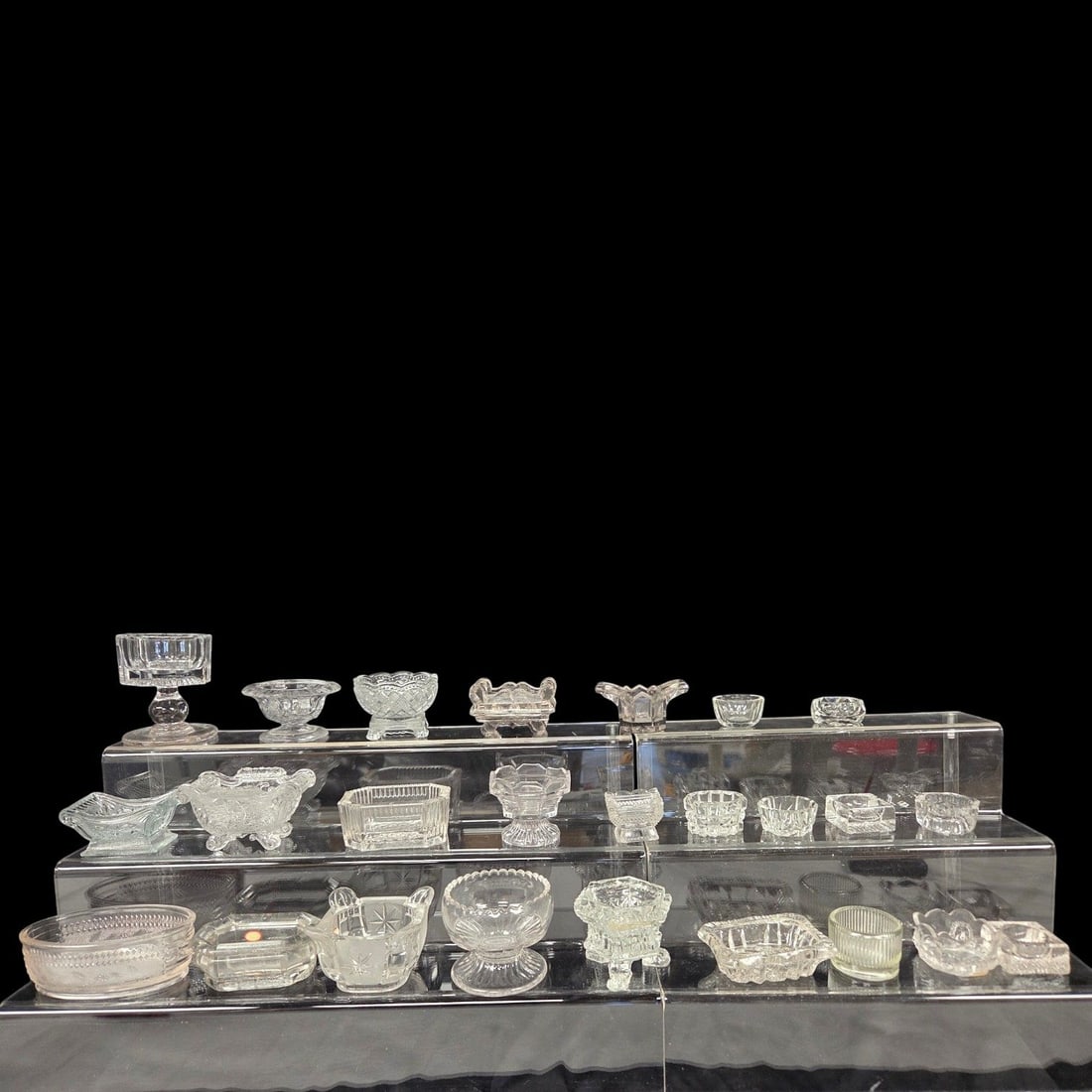 25 PIECE LOT OF SALT CELLARS: 25 Piece lot of assorted salt cellars. Includes pressed and cut glass, small and master salts. Good condition. See photos.