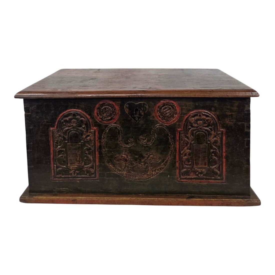 JAKARTA CARVED WOOD CHEST: Jakarta hand carved wood chest or storage box. The front facade of the box consists of two arched panels with intricate floral motifs in the center. Two circular rosettes are located by keyhole lock.