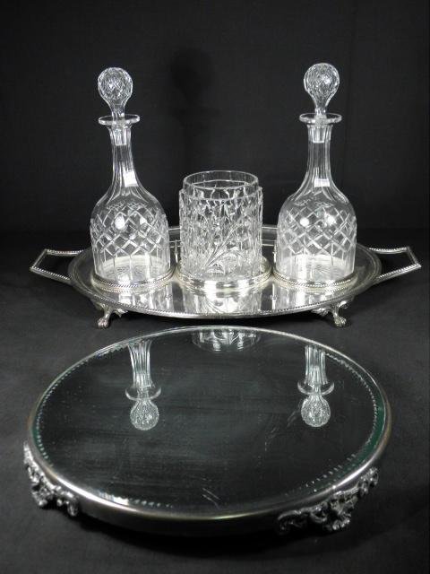 CRYSTAL & SILVER PLATED TABLEWARES: PLATEAU, ETC. 5 PCS: Lot of assorted crystal and silver plated tablewares. Includes a silver plated plateau with mirrored cut glass insert, a silver plated bar tray with two cut crystal decanters, and an earl pressed glas