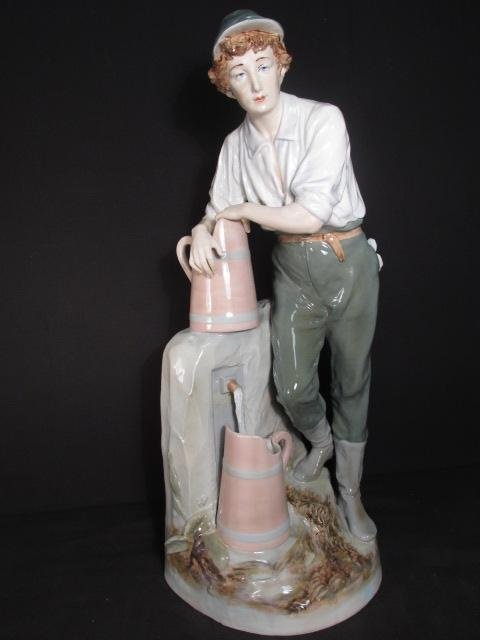 LARGE ROYAL DUX PORCELAIN SCULPTURE: BOY AT WELL: Large Royal Dux porcelain sculpture of a boy standing at a well. Marked on base "Royal Dux, Made in Czechoslovakia". Condition: professional restoration to base, see images. Measures 24" tall. Shippin