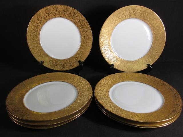 NINE BAVARIAN EMBOSSED GOLD RIMMED PLATES: Lot of nine Bavarian embossed gold rimmed 10.75" plates. Each marked on base. Condition: generally good, see images. Total weight: 13.5 lbs.