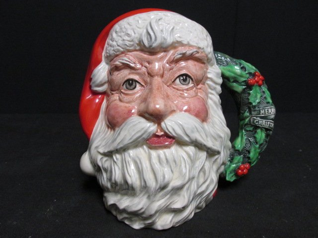 RARE ROYAL DOULTON PORCELAIN TOBY JUG: SANTA W/ WREATH: Rare Royal Doulton porcelain toby jug depicting Santa Claus, with a wreath form mug handle. Marked on base with "Royal Doulton" crown mark, and "Royal Doulton Santa Claus Modelled by Michael Abberley 