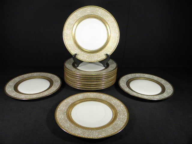 TWELVE HEINRICH & CO EMBOSSED GILT SERVICE PLATES: Lot of twelve Heinrich & Company Bavarian porcelain service plates. Each plate is decorated with a floral embossed gilt banded pattern and is marked on base "H&Co Selb Bavaria Heinrich&Co". Includes p