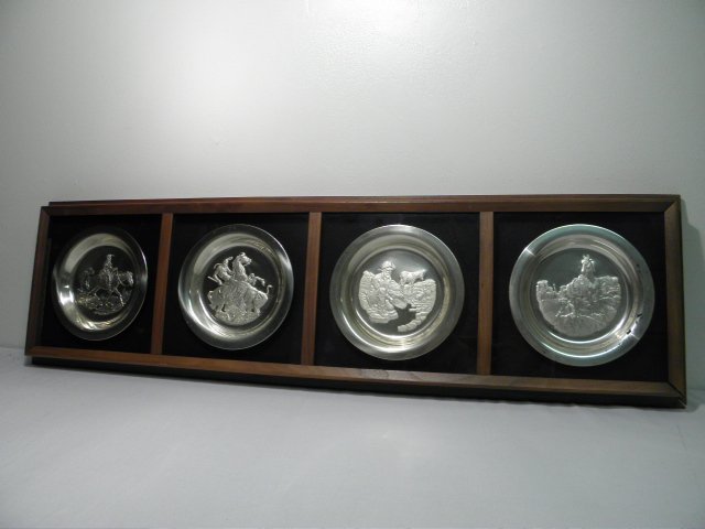 FOUR FRAMED FRANKLIN MINT STERLING SILVER PLATES:: Lot of four embossed sterling silver plates by various artists for the Franklin Mint. All are framed in a horizontally oriented shadow box and depict Western themes. Artists include Gordon Phillips, J