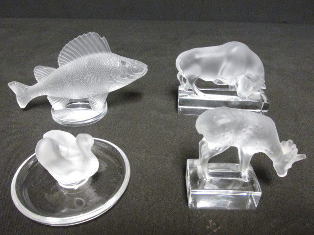 FOUR LALIQUE FROSTED CRYSTAL MINIATURE ANIMALS: Lot of four Lalique frosted crystal animals. Includes a 2.25" tall swan ring dish, a 4" long Bull weight, a 3.25" long deer weight, and a 6" long fish. All pieces signed on base "Lalique France". Cond