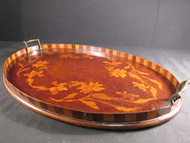 ART NOUVEAU OVAL MARQUETRY INLAID TRAY: Art Nouveau oval shaped marquetry inlay tray in the manner of Galle'. Measures 25.5" long x 17" wide. Condition: minor dings/scuffs to edges, minor cracks to lip, see images. Total weight: 3.5 lbs.