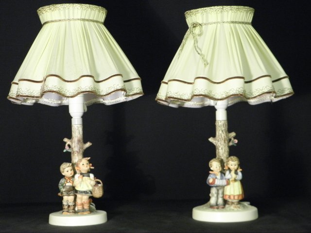 TWO HUMMEL TABLE LAMPS: BIRTHDAY SERENADE & TO MARKET: Lot of two Hummel German porcelain table lamps. Includes "To Market", mould #223, trdmark 3; and "Birthday Serenade", mould #231, trdmark 5. Condition: minor soiling and fraying to shades, very minor 
