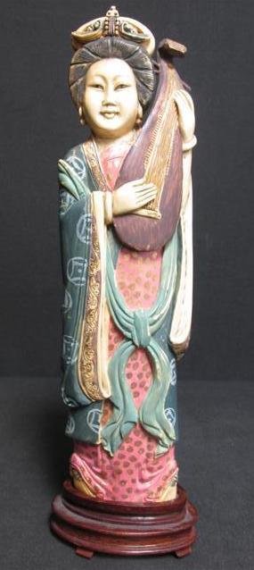CHINESE CARVED & POLYCHROMED IVORY FIGURE OF A WOMAN: Chinese carved and polychromed figure of a woman playing a string instrument. Includes fitted carved wood base. No marks on base. Appears to have possibly been later painted. Condition: good, very min