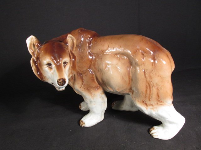 ROYAL DUX PORCELAIN SCULPTURE OF A BEAR: Royal Dux porcelain sculpture of a bear. Marked on stomach "Royal Dux Made in Czechoslovakia". Condition:no chips or cracks, see images. Measures 9.5" tall x 11.75" long. Shipping weight 5 lbs.