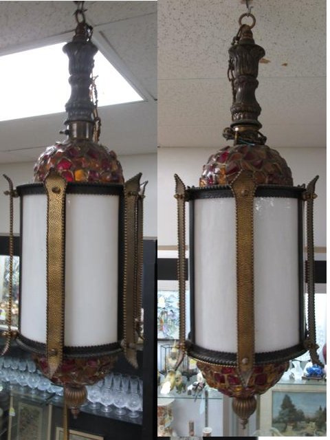 PAIR MOROCCAN STYLE MID-CENTURY BRASS HANGING LANTERNS: Pair Moroccan style 20th century brass hanging lanterns. Both feature a white glass shade and chipped glass mosaic designs. Single bulb light fixture inside each lantern. Each lantern measures a total