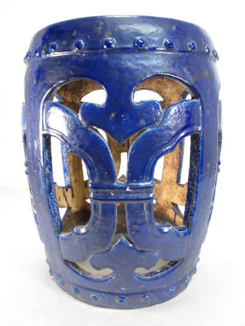 CHINESE COBALT GLAZED STONEWARE GARDEN SEAT: Chinese deep cobalt glazed stoneware garden seat, circa early 20th century. Measures 18.5" tall x 14" wide. Condition: minor wear and crazing to glaze, no cracks or repairs, see images. Weight: 34 lbs