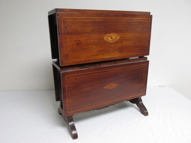 19TH CENTURY MAHOGANY TWO TIER DROP LEAF TABLE: 19th century inlaid mahogany two tier drop leaf table. Total of four leafs that fold up. Condition: wear and signs of age to finish, repaired where second tier legs meet first tier table surface, see 