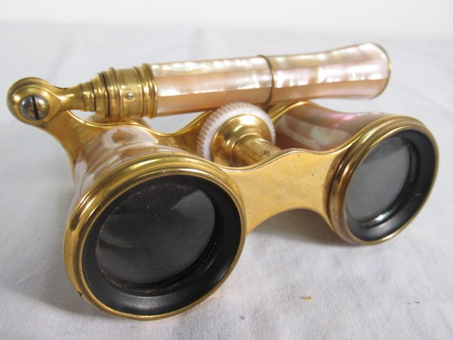 FRENCH LEMAIRE FABT MOTHER OF PEARL OPERA GLASSES: Pair of French Lemaire Fabt mother of pearl and brass opera glasses. Marked on left eye holes "Lemaire Fabt Paris". Condition: missing mother of pearl veneer over right eye hole, minor signs of age, s