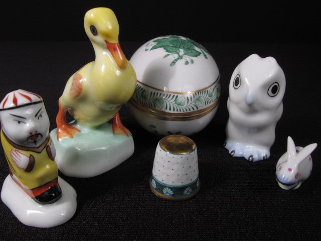 SIX HEREND MINIATURES: EGG BOX, THIMBLE, ETC.: Lot of assorted Herend porcelain miniatures. Includes a small 3" long egg shaped box, a 2.5" tall figure of a duck, a 1.75" tall white owl, a 1.75" tall miniature China man, a tiny .75" tall rabbit, a