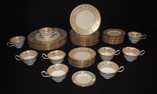 WEDGWOOD "GOLD FLORENTINE" PORCELAIN DINNERWARE: 51 PCS: Lot of assorted Wedgwood "Gold Florentine" porcelain dinnerware. Includes 51 total pieces: (9) 5.1" wide cups, (8) 5.8" saucers, (12) 6" plates, (12) 8.2" plates, (8) 10.75" plates, and (2) 4.5" wide 