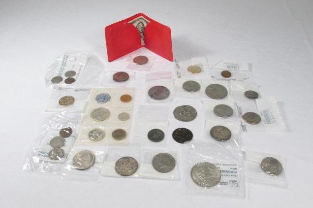ASSORTED DOMESTIC & FOREIGN COINS & CURRENCY: Large lot of assorted domestic and foreign coins and currency. Includes an uncirculated 1960 Philadelphia mint set, a $2 bill, various dollar and half dollar pieces, an Indian head/Buffalo nickel, Sac