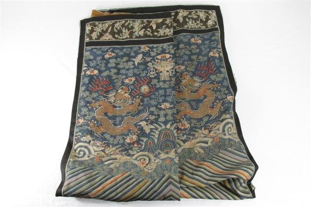 19TH CENTURY JAPANESE SILK TAPESTRY: 19th century Japanese silk tapestry depicting an elaborate scene with waves, dragons, bats, butterflies, mountains and much more. Stitched in the manner of a quilt (many pieces of fabric stitched toge