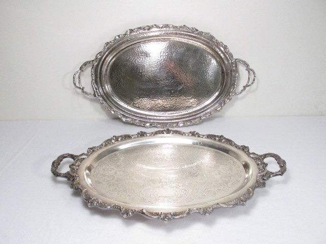 TWO SILVER PLATED SERVING TRAYS: Lot of two silver plated serving trays. The first is made by Michael Aram and is signed on base, and the second is made by Poole (Olde English pattern). Condition: minor signs of wear and use, some sc