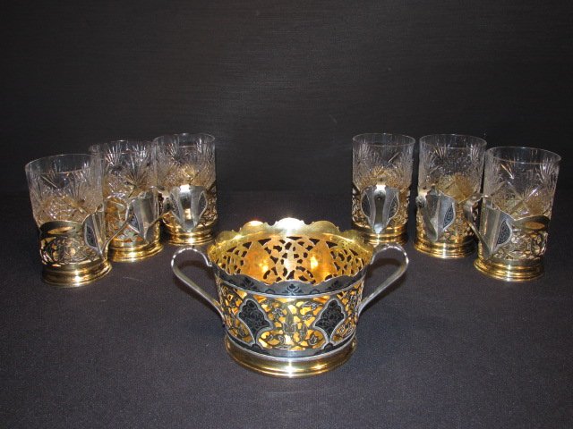 RUSSIAN NIELLOWORK SILVER & CRYSTAL DRINK SET - 7 PCS: Mid-Century Russian niellowork pierced silver and crystal drink set comprised of (6) cups with cut crystal inserts, and (1) 7.25" wide (handle to handle) coaster. All pieces marked with unknown maker'