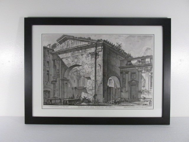 FRAMED ETCHING AFTER GIOVANNI PIRANESI: Framed etching after Giovanni Piranesi, titled "Veduta dell' Atrio del Portico di Ottvia". Matted and behind acrylic in a black finish frame. Condition: good, very minor wear to edges of frame, see im