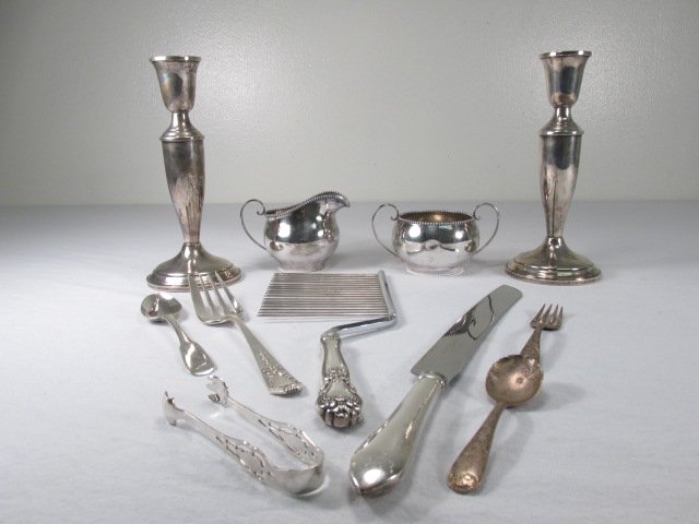 ELEVEN PIECES ASSORTED STERLING SILVER: CANDLESTICKS,: Lot of eleven pieces of assorted sterling silver. Includes a creamer, sugar bowl, a pair of weighted candlesticks, a Web sterling handled cake knife, a sterling handled cake cutter, and five other var