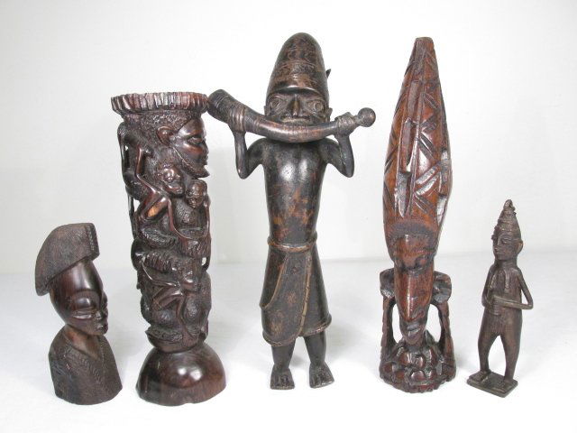 AFRICAN WOOD CARVINGS & BRONZE STATUES: 5 PCS: Lot of what appears to be African carvings and statues, five pieces total. Includes a carved ebony wood figural totem, a carved wood bust, a carved wood tribal figure, a bronze man holding horn, and a