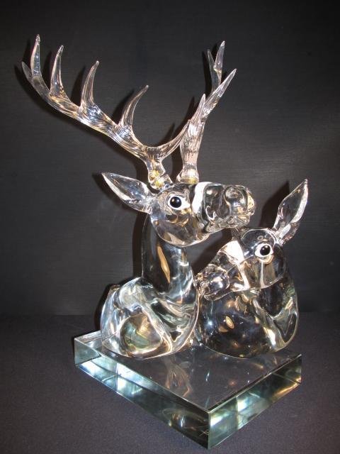 PINO SIGNORETTO LARGE GLASS SCULPTURE OF DEER: Pino Signoretto clear glass sculpture depicting two deer laying down. Signed on backside of base "C. Canali, Pino Signoretto" along with additional illegible writing. Antlers are detachable for transp