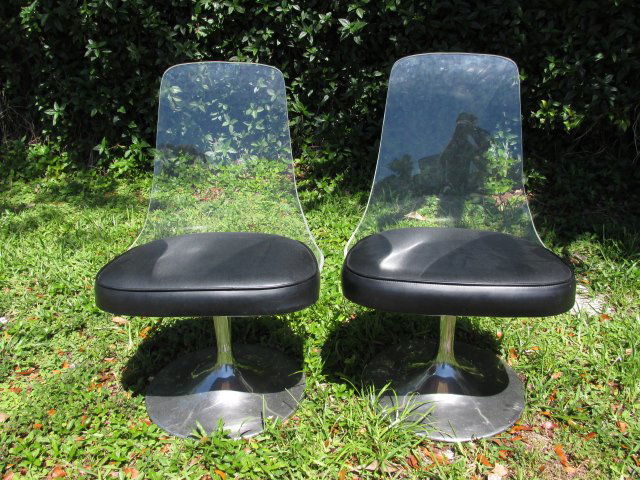 PAIR VINTAGE JANSKO LUCITE & LEATHER SWIVEL CHAIRS: Pair of vintage Jansko lucite and leather swivel chairs. Chrome finished tapered bases and clear lucite chair backs. Marked with tag under seat. Condition: minor signs of age, generally good, see imag