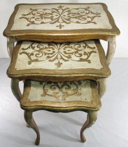 THREE SMALL ITALIANATE GILT WOOD NESTING TABLES: Lot of three small Italianate giltwood nesting tables. Largest measures 22.75" tall x 21.5" wide, smallest measures 17" tall x 12.75" wide. Condition: minor repairs to a few legs, wear to finish as ex