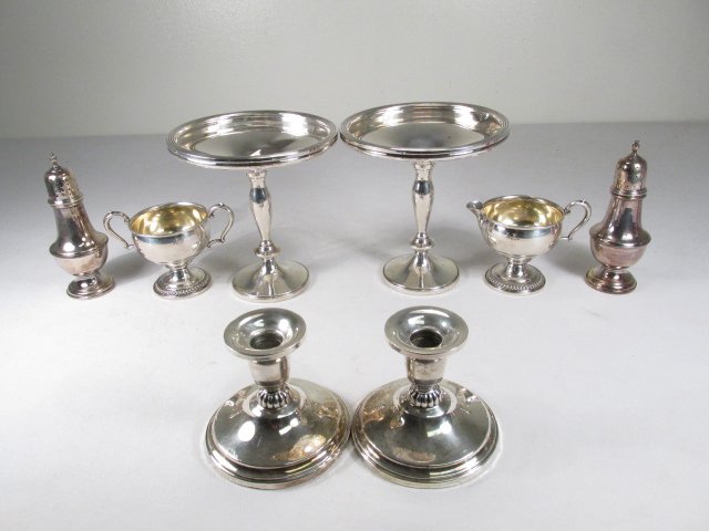 STERLING SILVER TABLEWARES: COMPOTES, CANDLESTICKS,: Lot of assorted sterling silver tablewares. Includes a pair of candlesticks, a creamer & sugar set by W.M. Rogers, a pair of master salt and pepper shakers, and a pair of compotes. All pieces either r