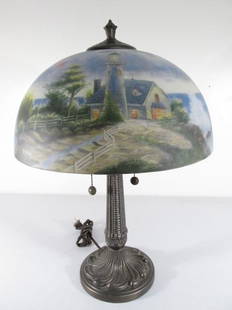 THOMAS KINKADE REVERSE PAINTED GLASS TABLE LAMP: Thomas Kinkade reverse painted table lamp depicting a lighthouse scene. Measures 22.5" tall x 15.5" wide. Condition: good, see images. Weight: 10 lbs.