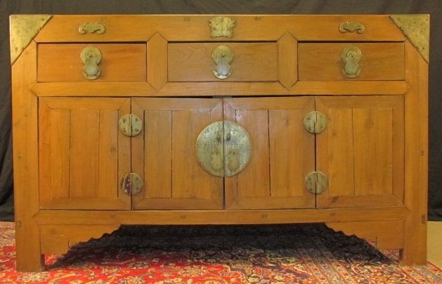 19TH C CHINESE QING CARVED ELMWOOD SIDEBOARD: Qing dynasty 19th century Chinese carved elmwood sideboard with engraved brass mounts and hardware. Bat form mounts above upper drawers, mortise & tenon construction. Condition: some minor splitting t