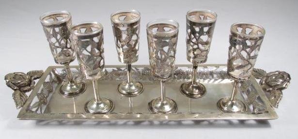 MEXICAN STERLING SILVER LIQUOR GLASSES & TRAY: Set of six Mexican sterling silver and glass liquor glasses, with a matching pierced sterling silver undertray. Each glass and undertray is stamped on base "Hecho en Mexica SNR .925 Sterling". Conditi