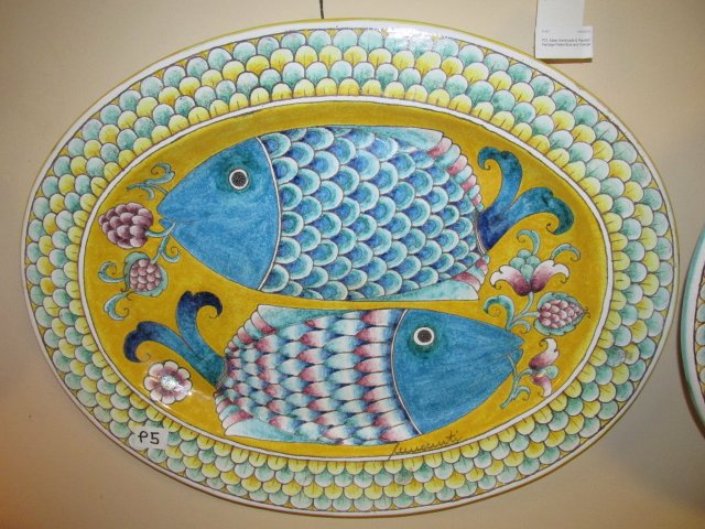 ITALIAN DOUBLE BLUE FISH MAJOLICA PLATTER: Dual blue fish platter, Italian handmade and painted, artist signed, wire hanger on back. Measurement: 26.5" x 20.75". Condition: Good, See images. Shipping weight is approx. 13.5 LBS