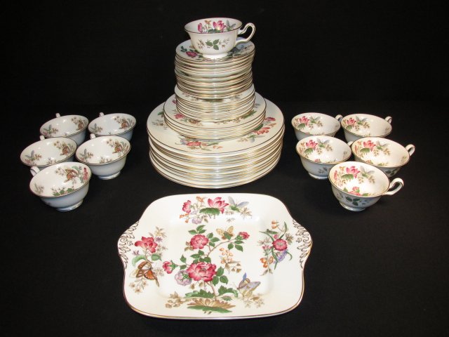 GROUP of (48) WEDGWOOD BONE CHINA DINNERWARE: Group of (48 pcs) Wedgwood bone china in the "Charnwood" pattern: (12) 10.75" plates, (8) 6" plates, (4) 8" plates, (12) 5.75" saucers, (11) 2.25" cups - 1 with a hairline crack, and (1) 10.75" x 9.25