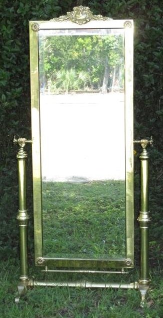 BRASS CHEVAL DRESSING MIRROR: Brass cheval dressing mirror measuring 67.25" tall x 32.75" wide. Condition: minor signs of use to brass finish, some light dings/dents, see images. Weight: approx. 70 lbs.