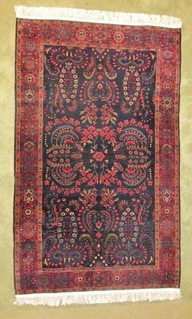 HAND KNOTTED PERSIAN WOOL CARPET: 6'7" x 4': Hand knotted Persian wool carpet, may be Sarouk. Measures 6 7" x 4'. Condition: very minor signs of wear and age, see images. Weight: approx. 10 lbs.