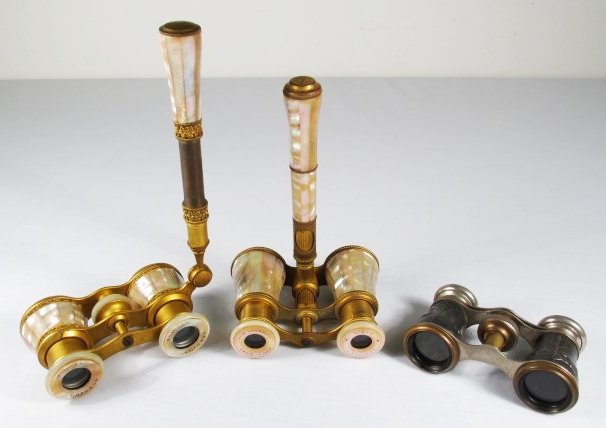 THREE PAIRS OF FRENCH OPERA GLASSES: LEMAIRE, FOWLER,: Lot of three pairs of assorted French opera glasses or theatre binoculars. Includes one Mother of pearl pair by Lemaire Fabt with handle adjustment, one mother of pearl pair marked "Made in France L.E