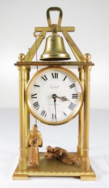 SWISS IMHOF GILT BRONZE FIGURAL SHELF CLOCK: Swiss made Imhof gilt bronze figural shelf clock. Man on the left appears to be ringing the bell when clock strike chimes. Condition: one key needs to be repaired at back, see images. Measures 9.75" t