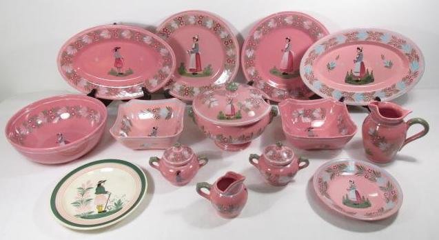 HENRIOT FAIENCE PINK QUIMPER (13) SERVING PIECES 1950s: A group of (13) Pink Quimper faience serving pieces of Henriot Faiencier company in Quimper, France. The pieces include: (1) 8.5" plate, (2) 15.5" oval platters, (2) 12.5" round platters, (2) 8" squar
