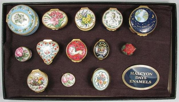 TWELVE HALCYON DAYS ENGLISH ENAMEL BOXES & SIGN: Lot of eleven Halcyon Days English enamel boxes and one enamel music box: "Love makes the world go round" which plays "What the World Needs Now" composed by Burt Bacharach. Lot also includes a 1.9" ta
