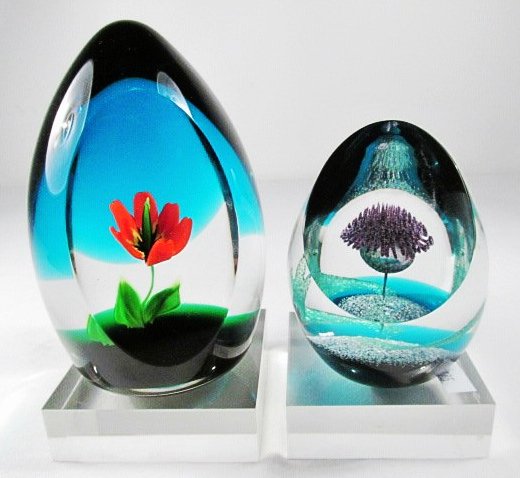 TWO CAITHNESS ART GLASS PAPERWEIGHTS: PRIDE & JOY, THE: Two Caithness, Scotland art glass paperweights: (1) 5.5" tall "PRIDE & JOY" 28/100, signed by Gordon Hendry. (1) 3.75" tall "SCOTLAND THE BRAVE" 2002, 426/500, signed by Martin Campbell. Condition: Go