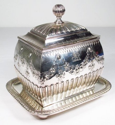 HENRY WILKINSON & CO. SHEFFIELD SILVER CASKET: An elaborately decorated silver plated casket by Henry Wilkinson & Co, ltd circa 1872-1892. Measures: 7 1/2" x 6" x 6 1/2" tall. Condition good. Shipping weight: 2 lbs.