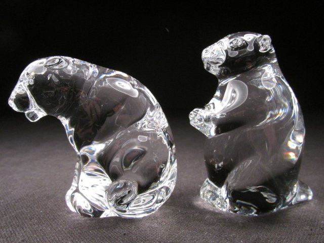 TWO STEUBEN CRYSTAL HAND COOLERS: GROUNDHOG & TIGER: Lot of two Steuben crystal hand coolers. Includes "New Groundhog" hand cooler #9664, and a tiger form hand cooler. Both pieces signed "Steuben" on base. Condition: good but for a few tiny manufactory 