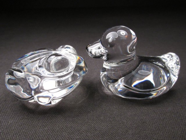 TWO STEUBEN CRYSTAL HAND COOLERS: DUCK & FROG: Lot of two Steuben polished crystal hand coolers. Includes a 2" tall duck, and a 1.5" tall frog. Both signed "Steuben" on base. Condition: one tiny blemish to duck, and one slightly smaller blemish to