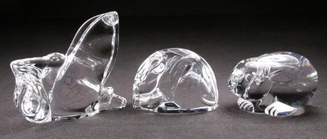 THREE STEUBEN CRYSTAL HAND COOLERS: MOUSE, RABBIT,: Lot of three Steuben polished crystal hand coolers. Includes a 1.75" tall crouching rabbit, a 1.8" tall crouching mouse, and a 2.8" tall Stork carrying a baby. Each piece signed on base "Steuben". Con