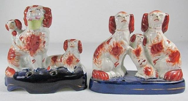 TWO STAFFORDSHIRE SPANIEL PEN HOLDERS: Lot of two Staffordshire porcelain pen holders, each depicting three Spaniels. One stand holds two pens, and the other, one. Condition: minor crazing, no apparent paint loss or cracks, see images. Lar