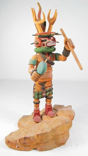 HOPI "DEER KACHINA", RAY JOSE GAI-NAH-NE: A Hopi kachina doll entitled "Deer Kachina" carved and painted by Pueblo artist Ray Jose (Gai-nah-ne). This sculpture stands 11.75" tall and is titled, signed and dated on the bottom. Condition: good 